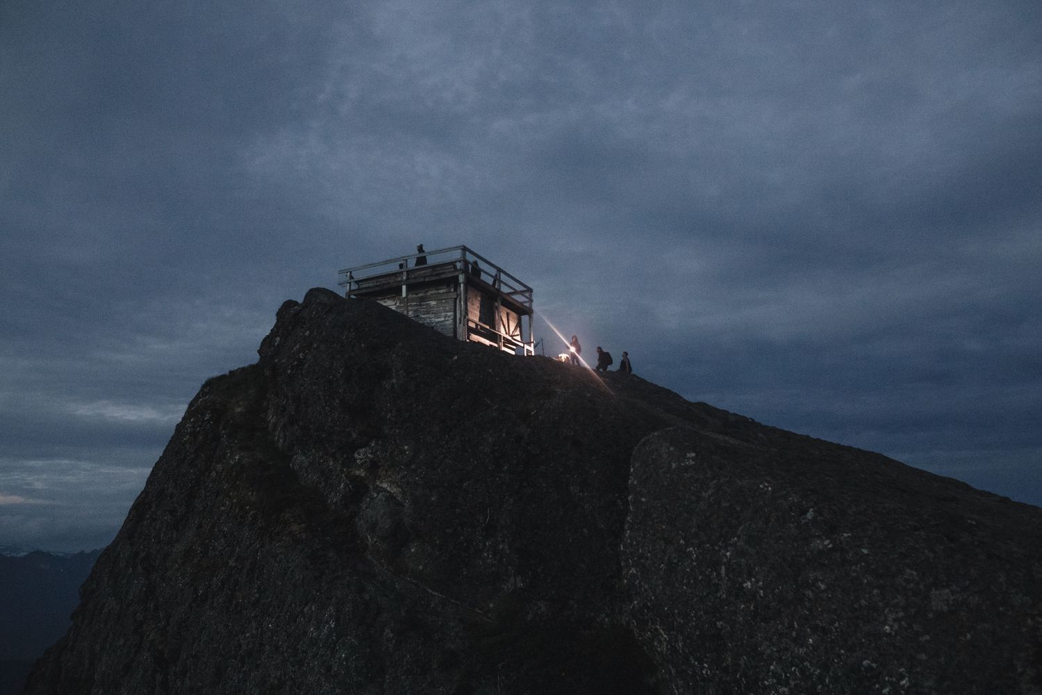 Couple elopes at High Rock Lookout, climbing to the top with headlamps in the dark.