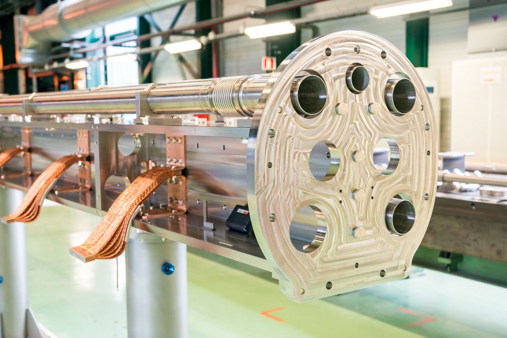 Aluminum industrial air ducts or ventilation components arranged in a manufacturing facility.