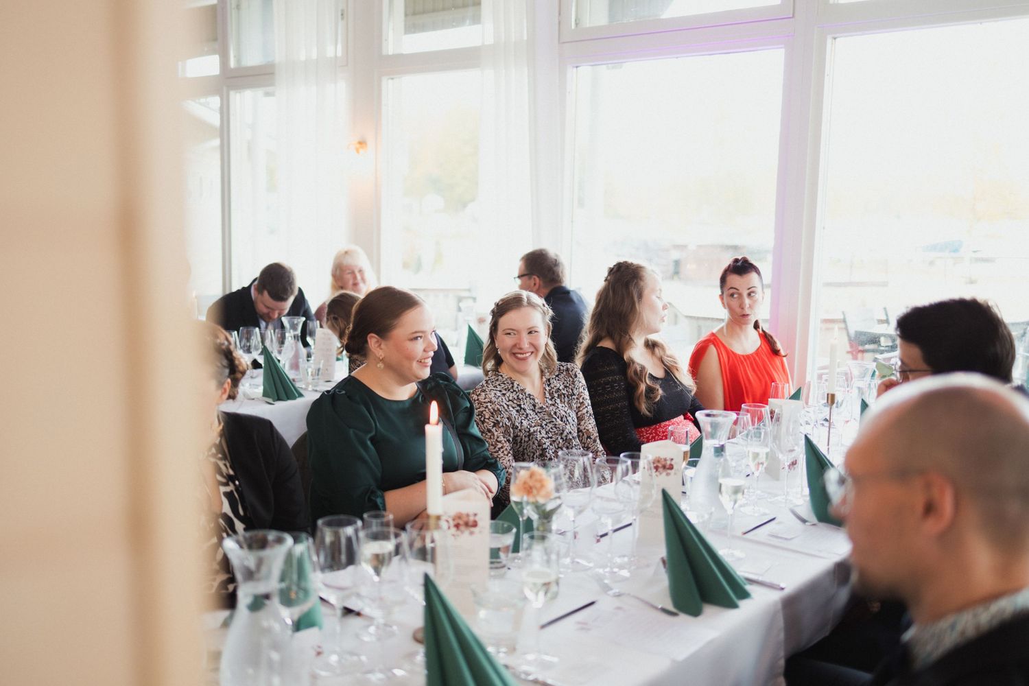Elegant wedding reception space with large windows and natural light.