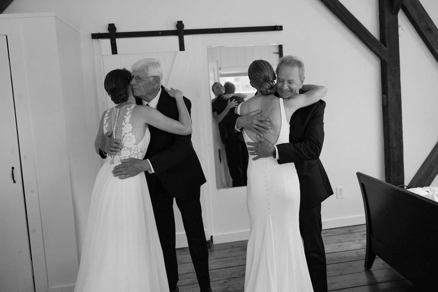 Black and white photos of wedding dress preparations in a minimalist white room.