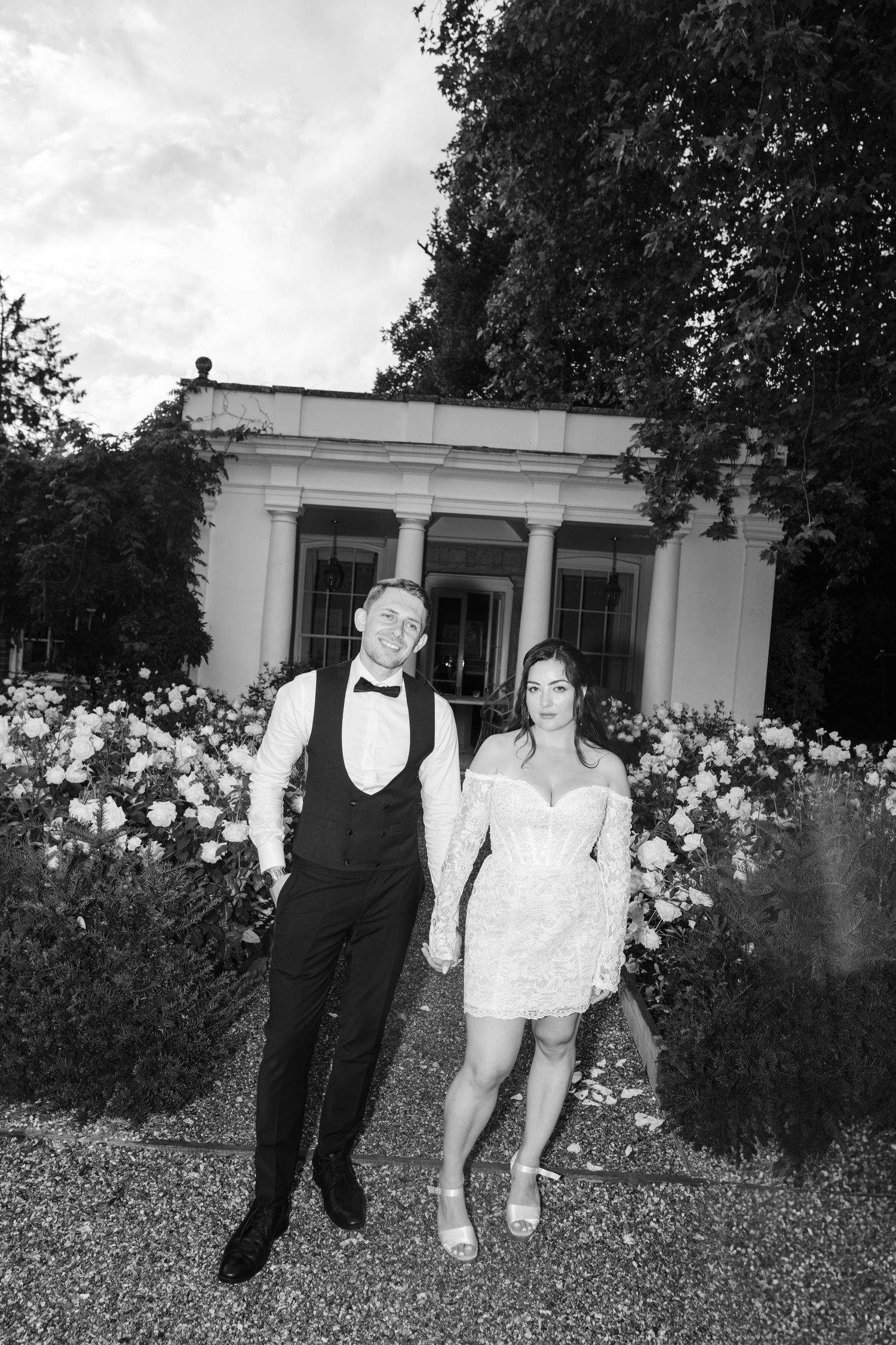 A black and white photo sequence shows a couple playfully running through a garden with flowering bushes.