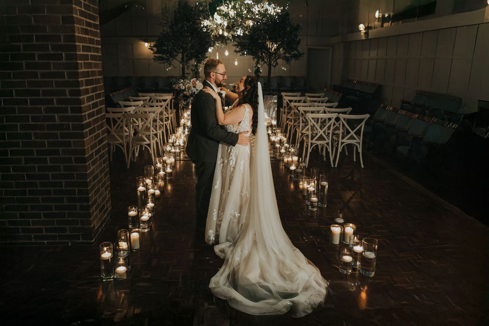 Larkspur lodge wedding photography bride groom ceremony room kiss candles