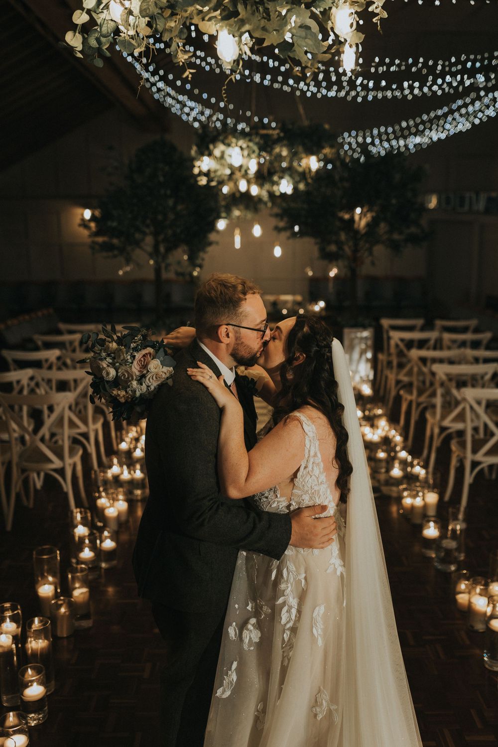 Larkspur lodge wedding photography bride groom ceremony room kiss candles