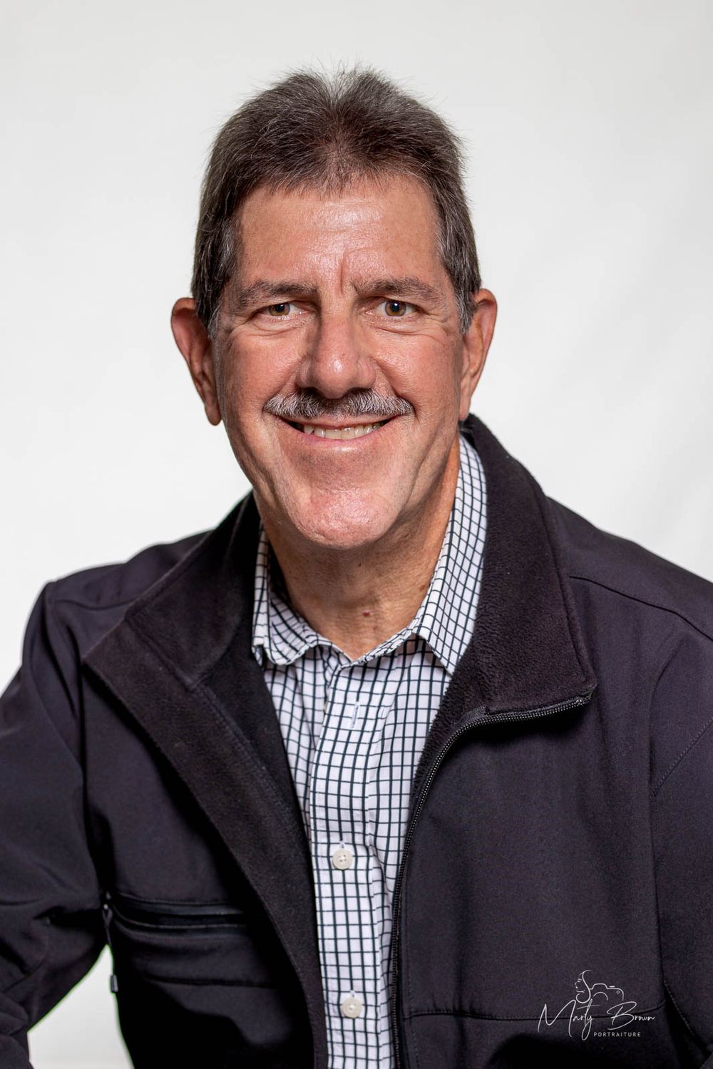 Corporate man sitting studio portrait