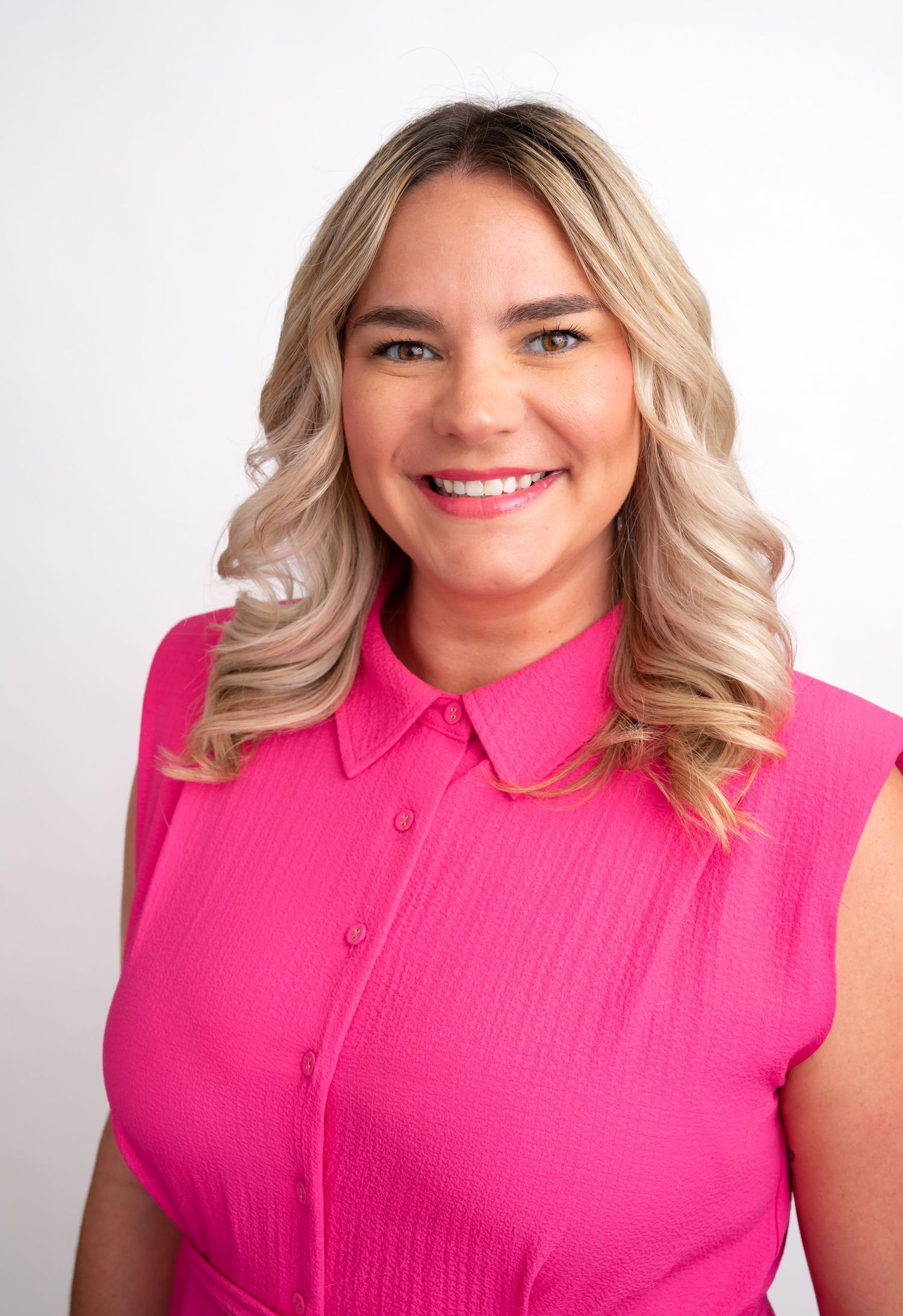 Professional studio portrait series of a person in a teal sleeveless top showing different angles in front of a white backdrop.