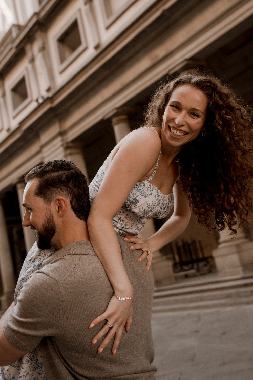 Romantic couple photoshoot sequence in front of a historical Uffizi gallery in Florence,Italy