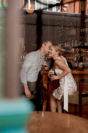 A romantic scene in a dimly lit restaurant with blurred foreground elements in Dublin,Ireland.