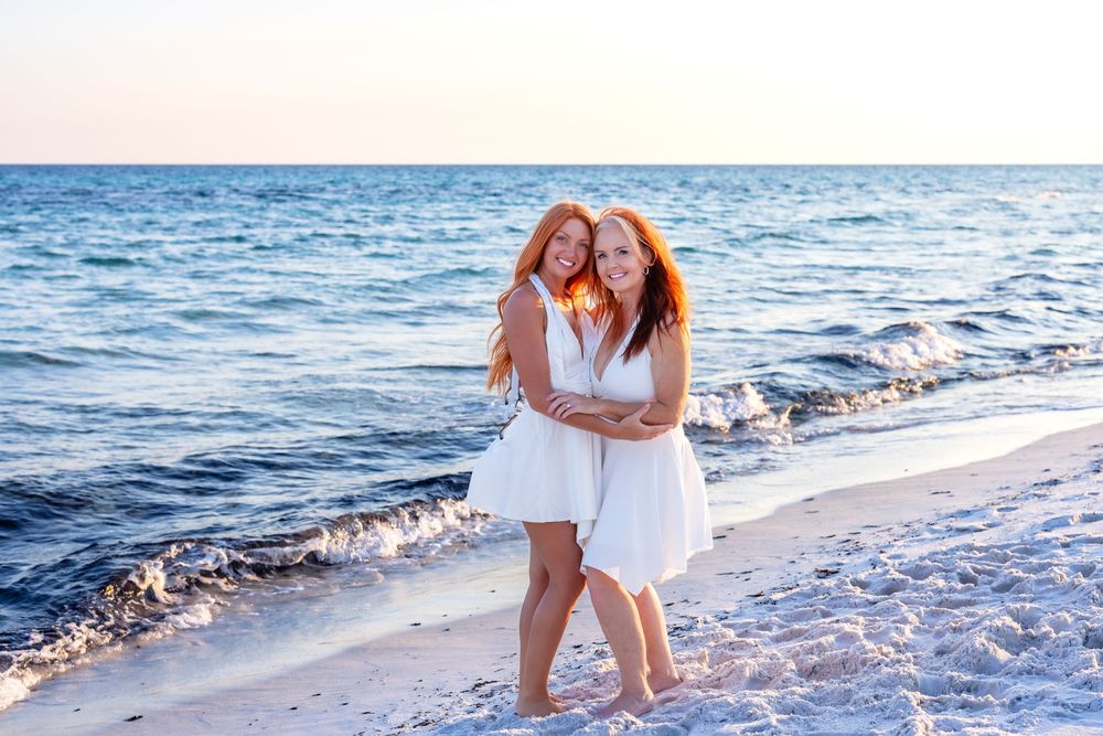 A collection of beach photographs showing people in white outfits walking and posing along the ocean shoreline at sunset.