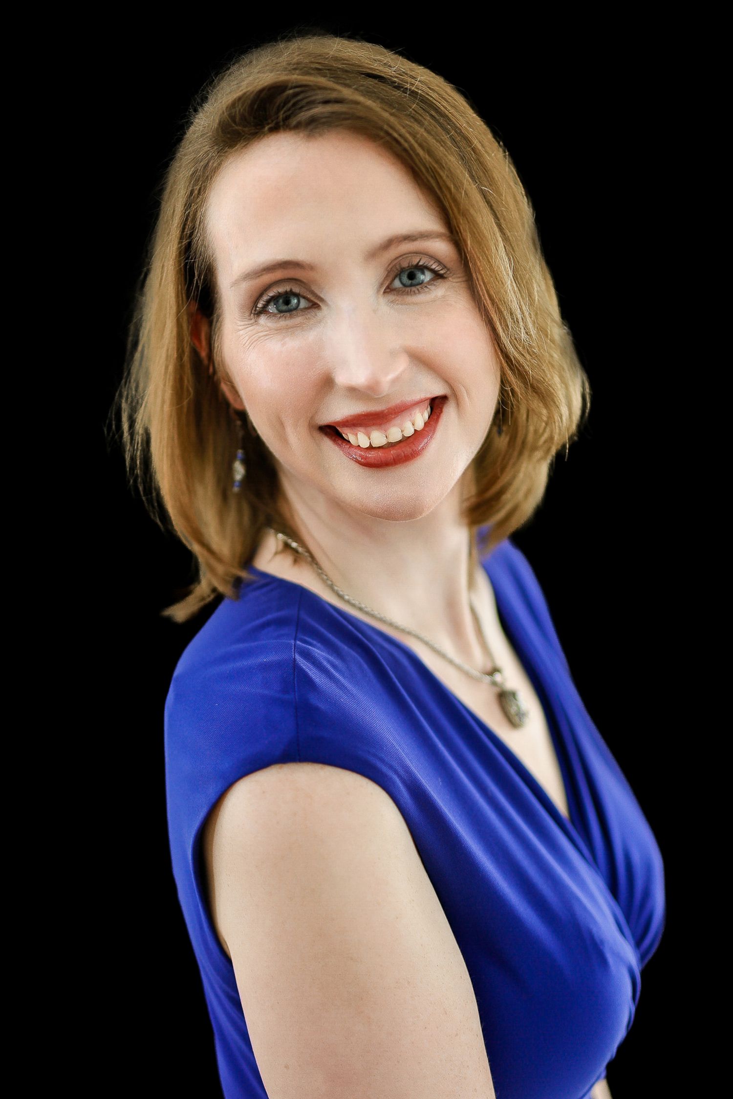 Clean studio-style self-promo headshot with neutral background, Essex County.