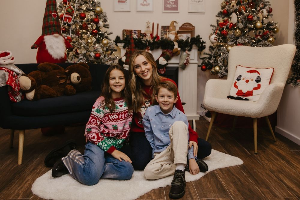 A series of Christmas photos showing a family sitting on a couch near decorated trees and holiday decor.