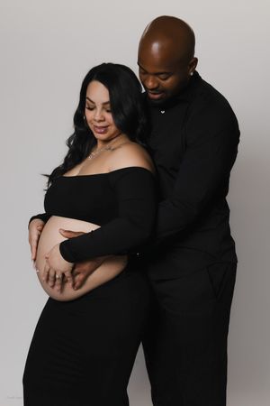 woman posing during a maternity portrait session in Pittsburgh by Camille Cupid Photography, natural editorial maternity photographer near m