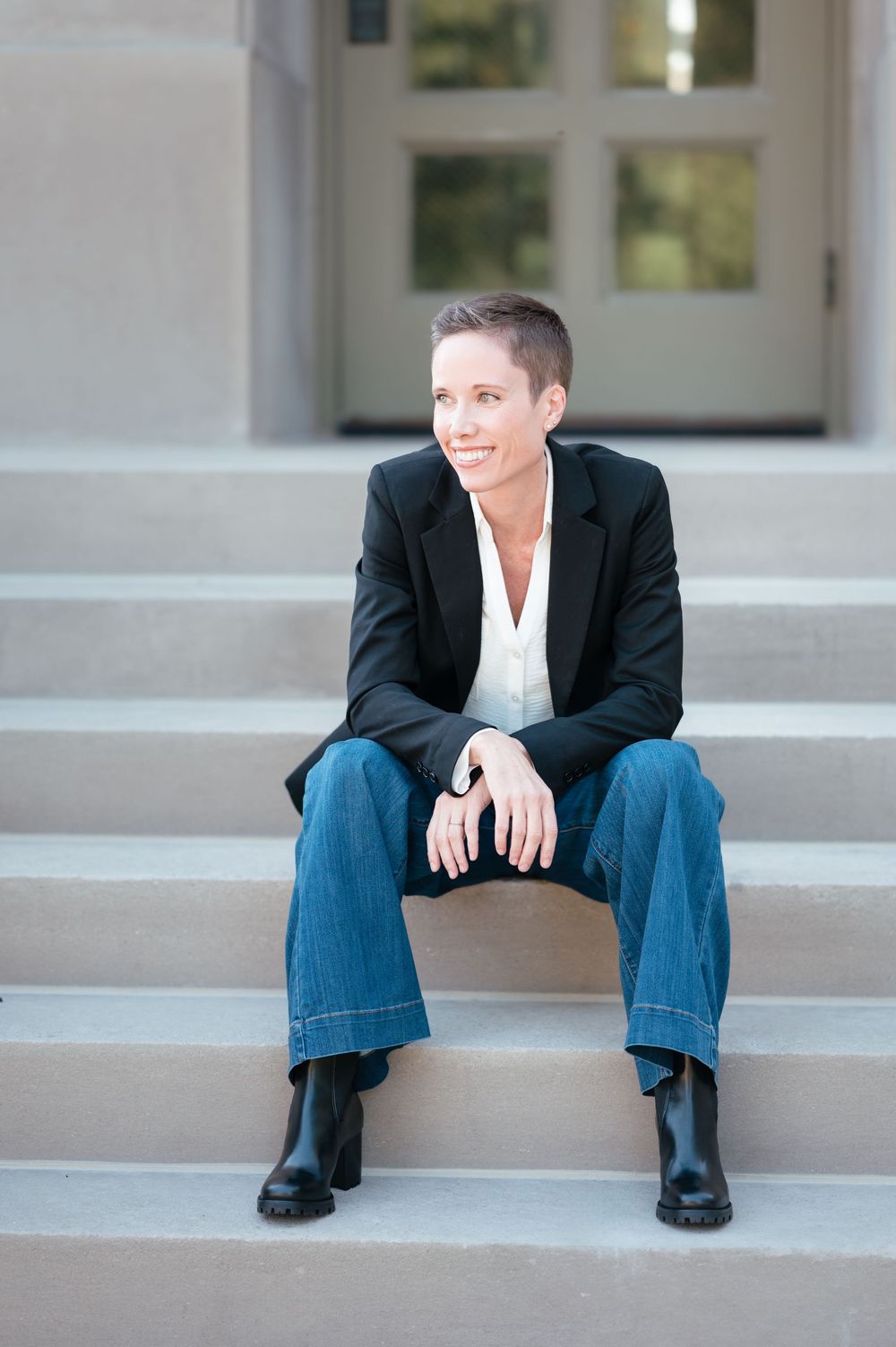 Professional headshot of a business woman with natural light and clean editing in Brookings, SD.