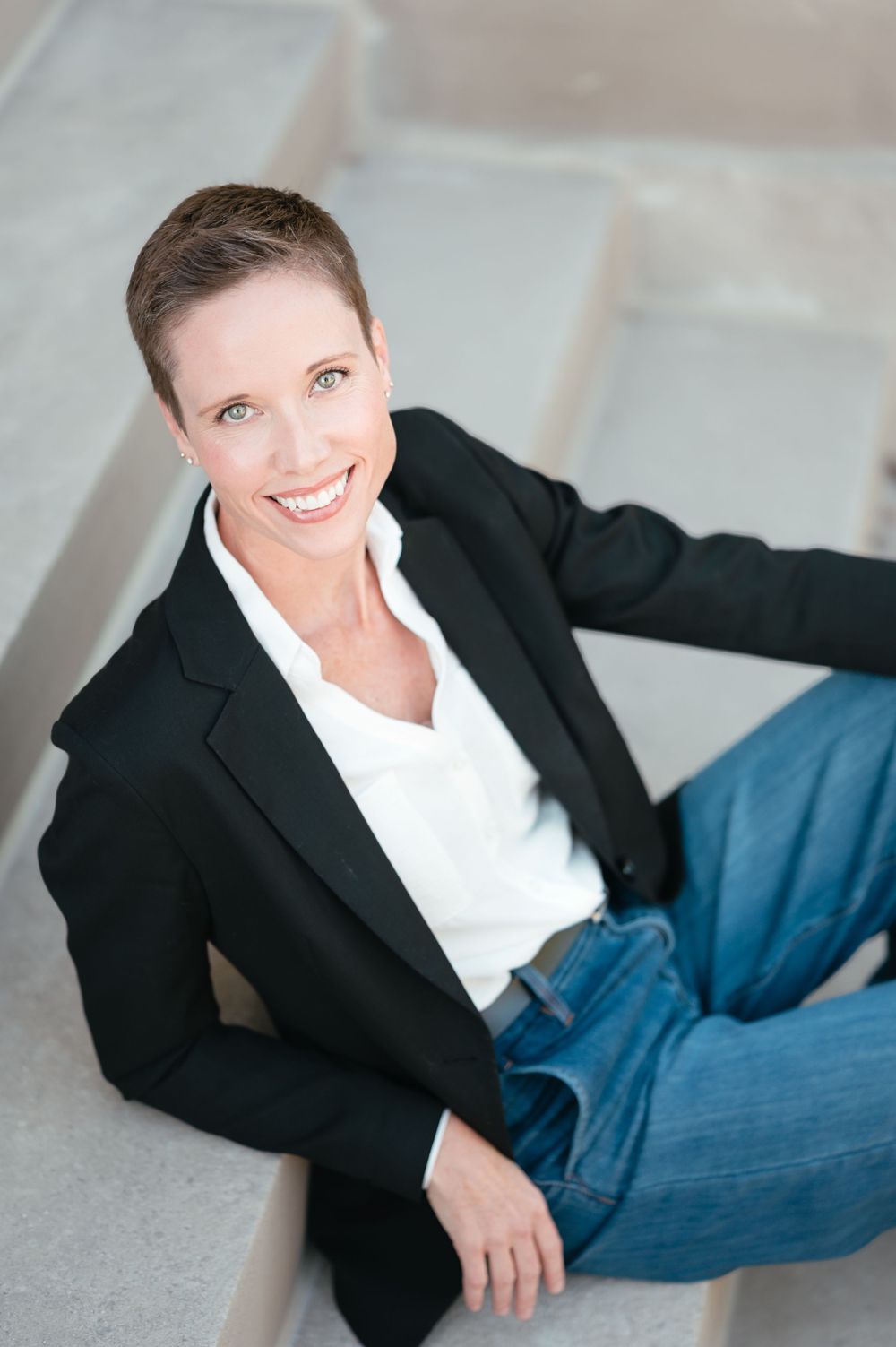 Professional headshot of a business woman with natural light and clean editing in Brookings, SD.