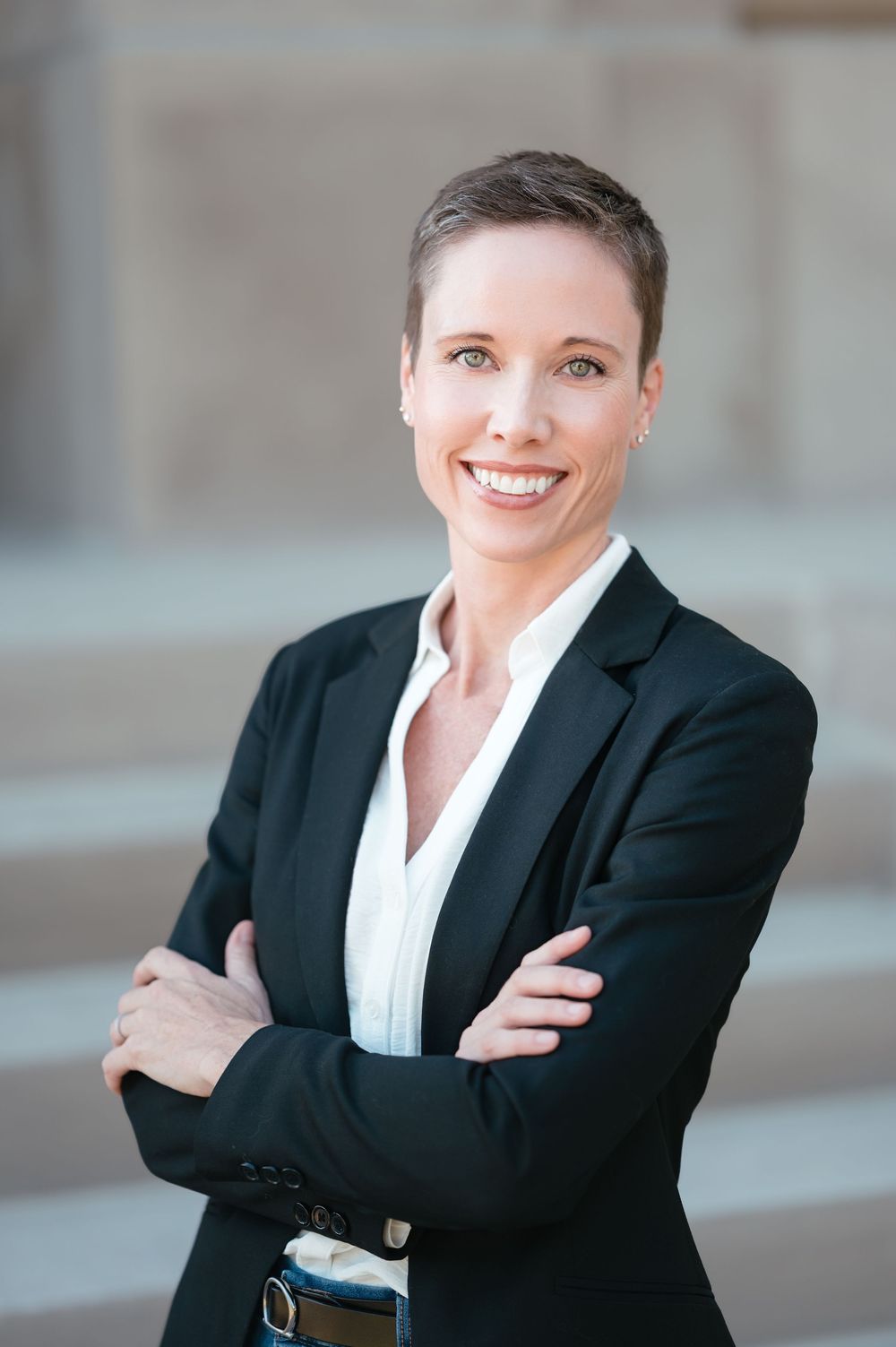 Professional headshot of a business woman with natural light and clean editing in Brookings, SD.