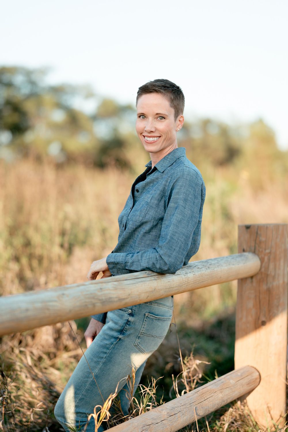 Professional headshot of a business woman with natural light and clean editing in Brookings, SD.