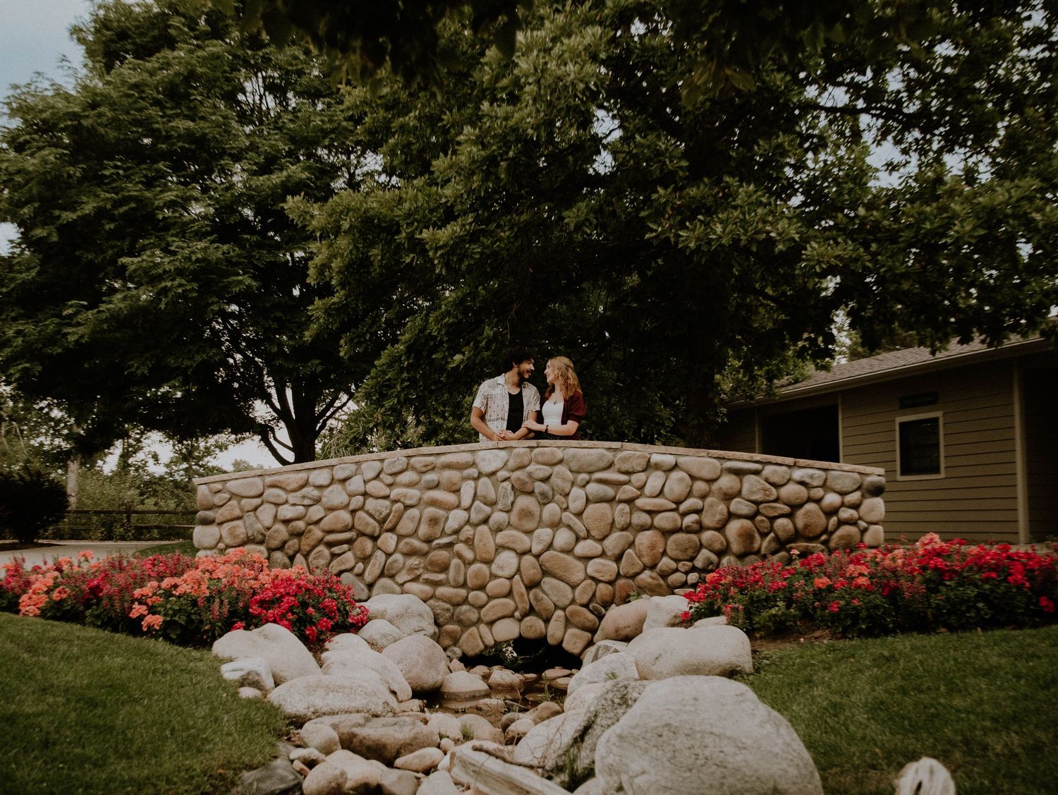 Couple stands and embraces each other for candid couples, garden, engagement photos, elopement, cinematic photos in Denver, Colorado