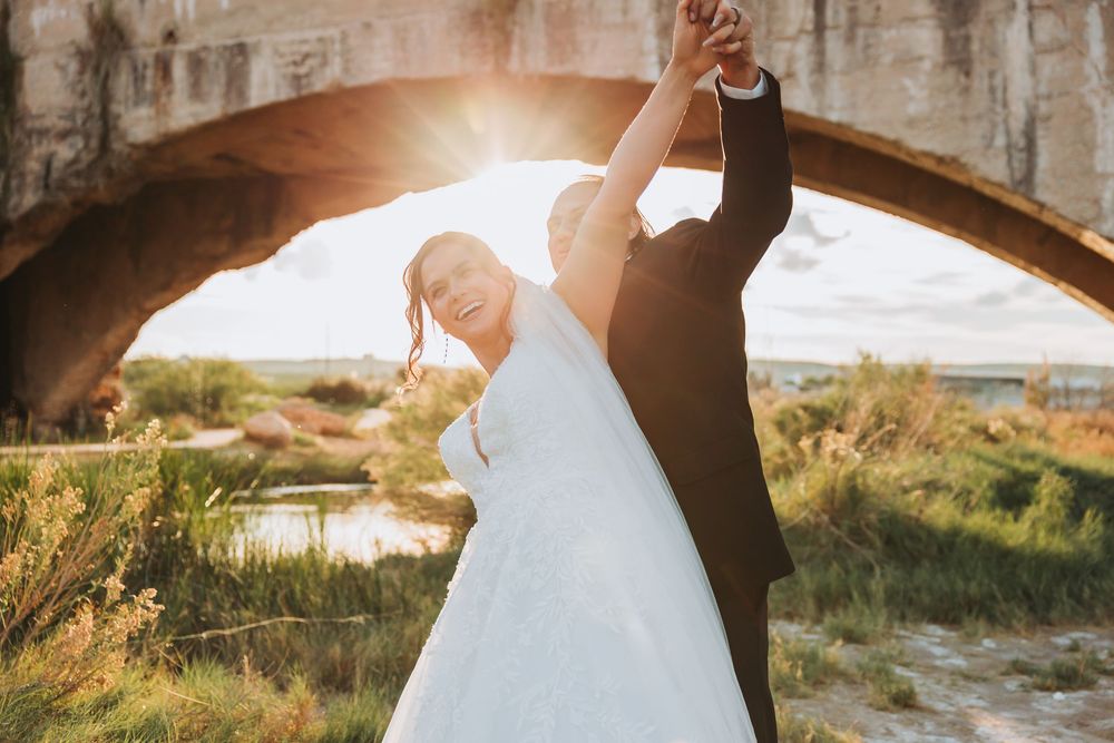 Romantic sunset wedding photos showing couple embracing in golden light with scenic outdoor backgrounds.