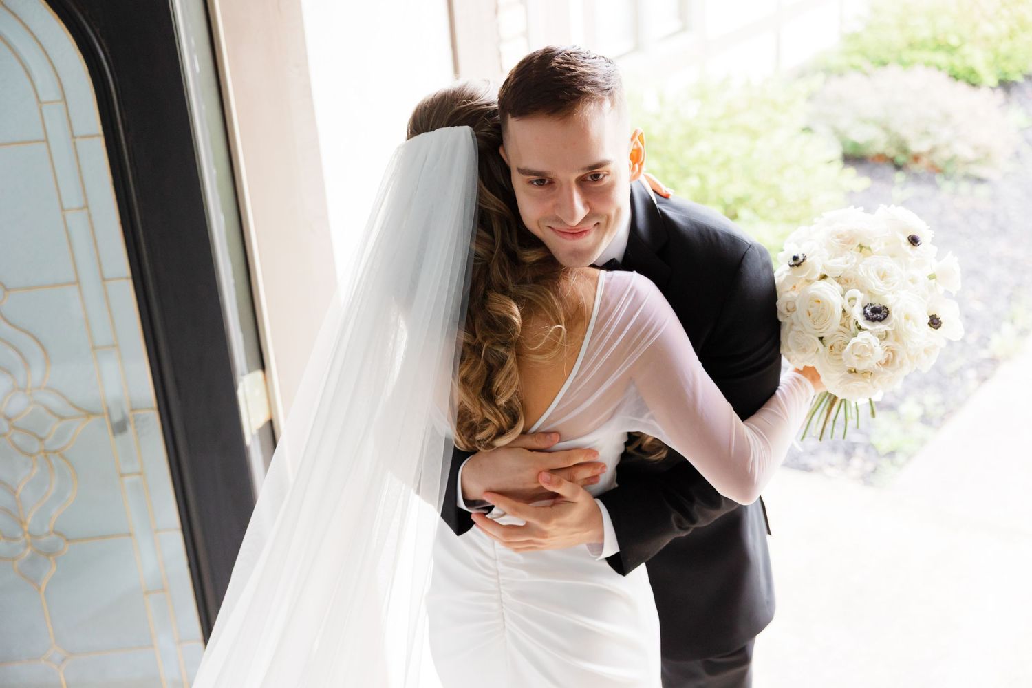 Bride and groom embrace captured by Tom Forrest Photography from Hudson, Ohio.