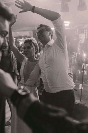 Black and white photos of people dancing and celebrating at a lively party or nightclub event.