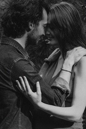 Black and white romantic couple photoshoot sequence showing intimate moments.