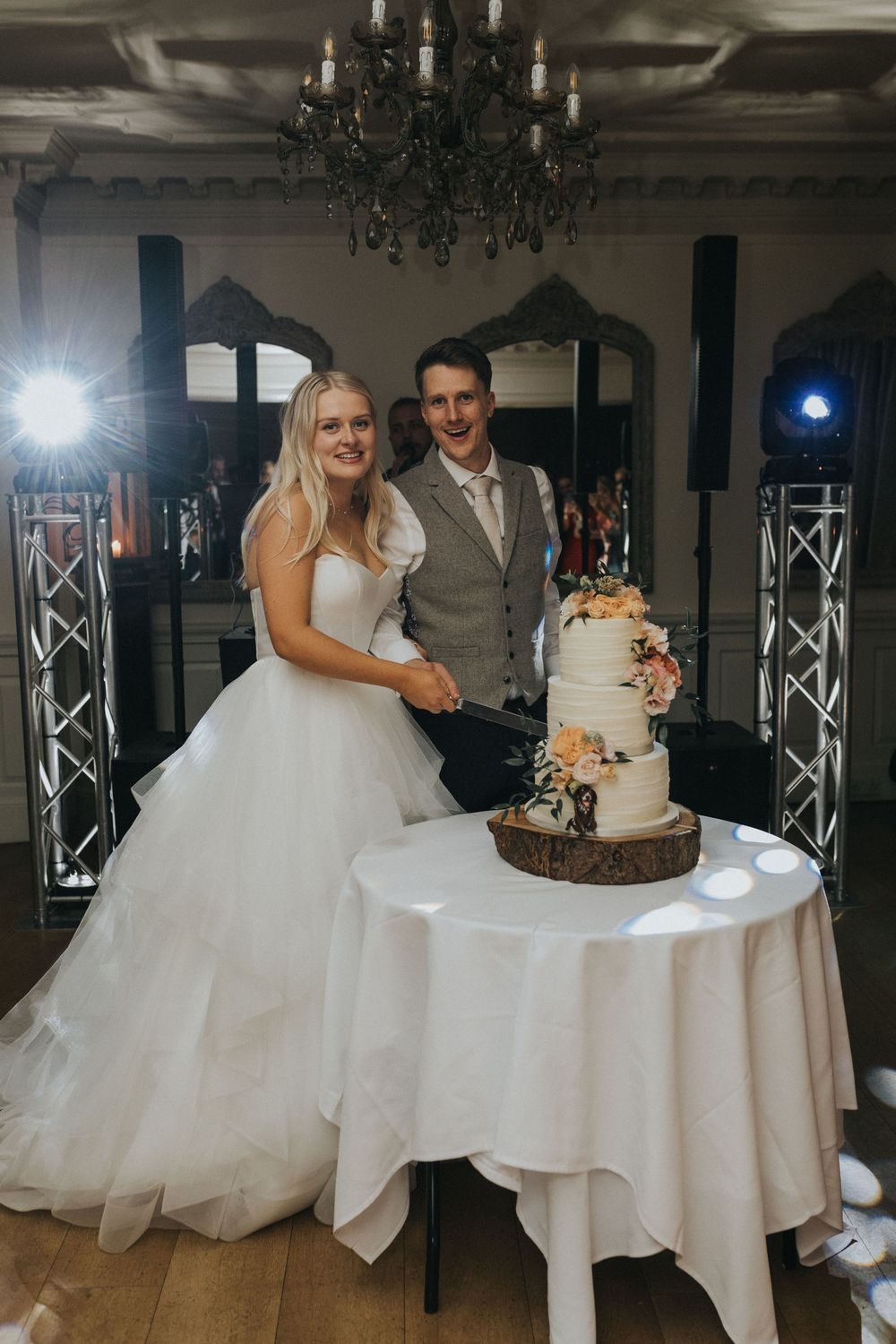 Eaves Hall Wedding Photography bride groom cake cut