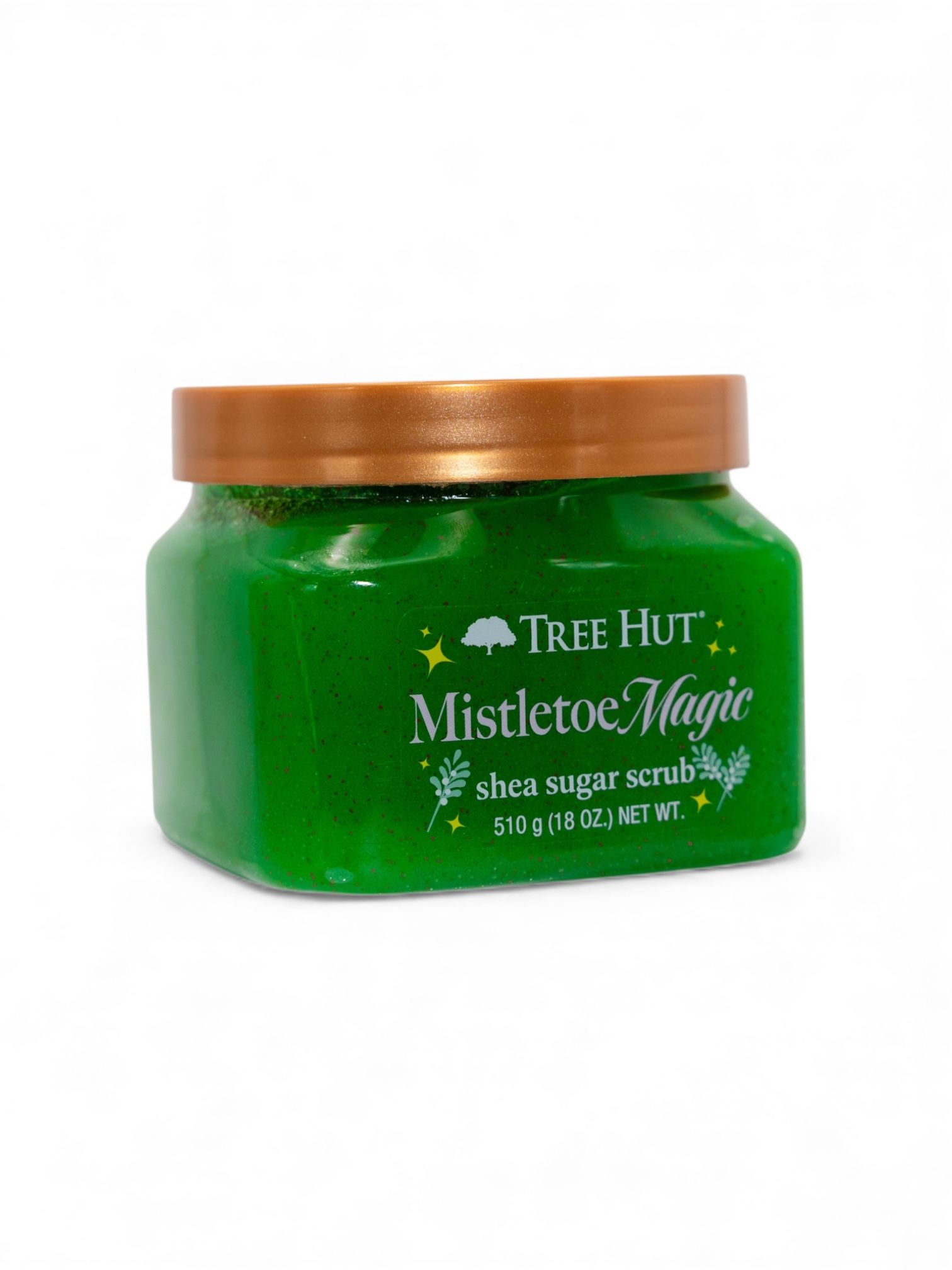 Green Tree Hut body scrub containers with gold lids lined up in a row showing product packaging design.