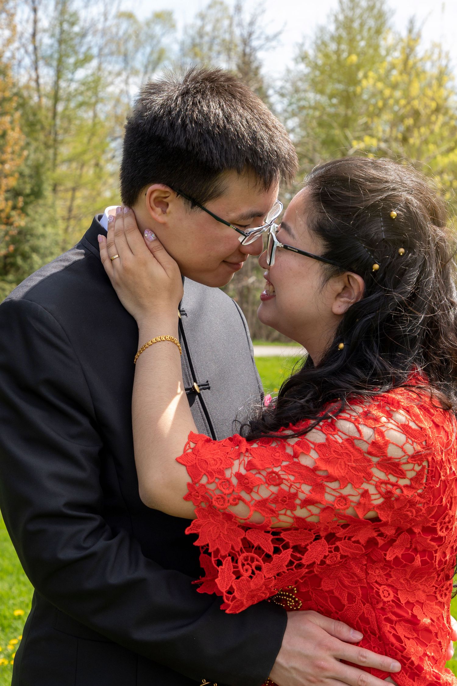 Bride and groom leaning in close to one another sharing a moment together.