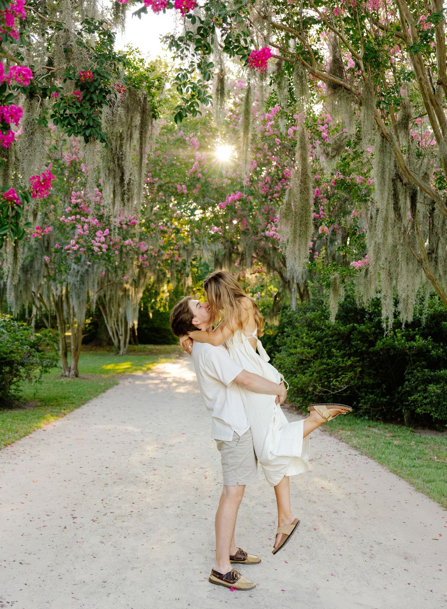 Loving couple sharing intimate moments during sunset beach photoshoot.