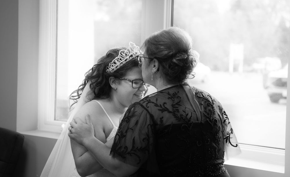 A series of romantic black and white photographs showing a couple kissing in various intimate poses.