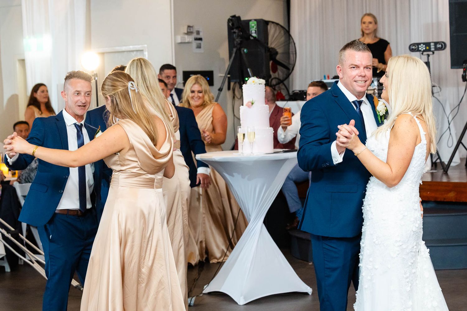 A series of wedding reception photos showing couples dancing and celebrating in formal attire.