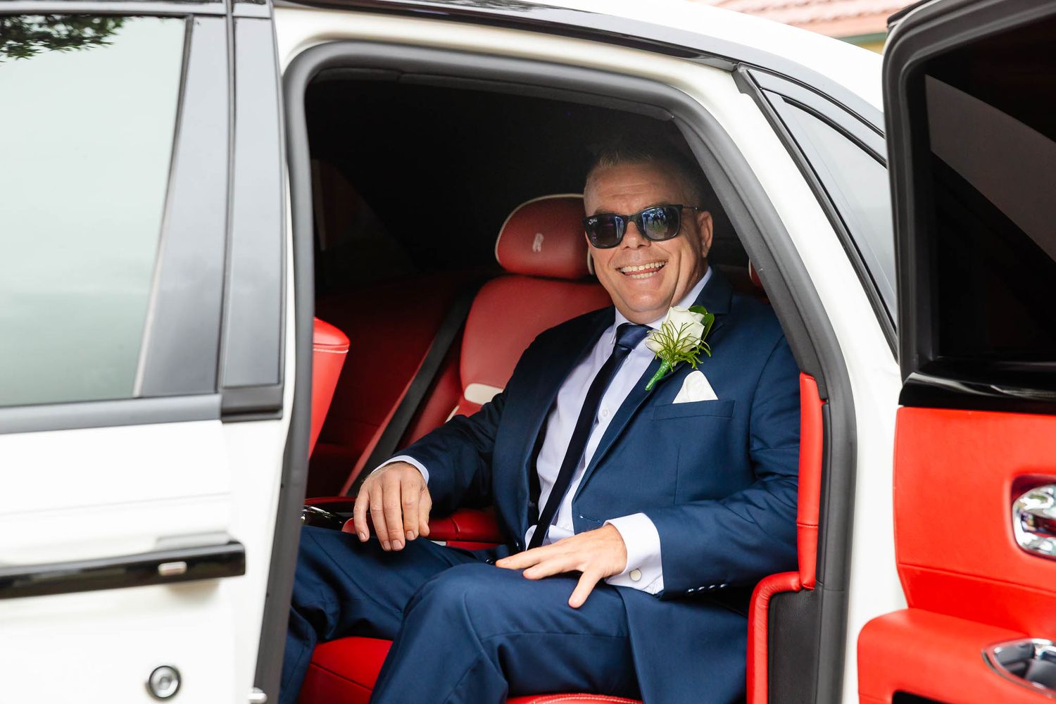 A sequence of images showing someone entering and sitting in a red car interior.