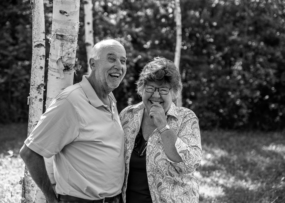 Family photographer capturing playful moments during session.