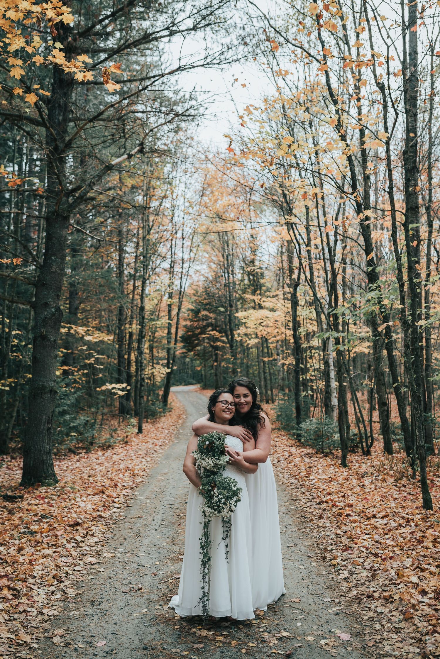 Couple embracing during golden hour wedding photography session.