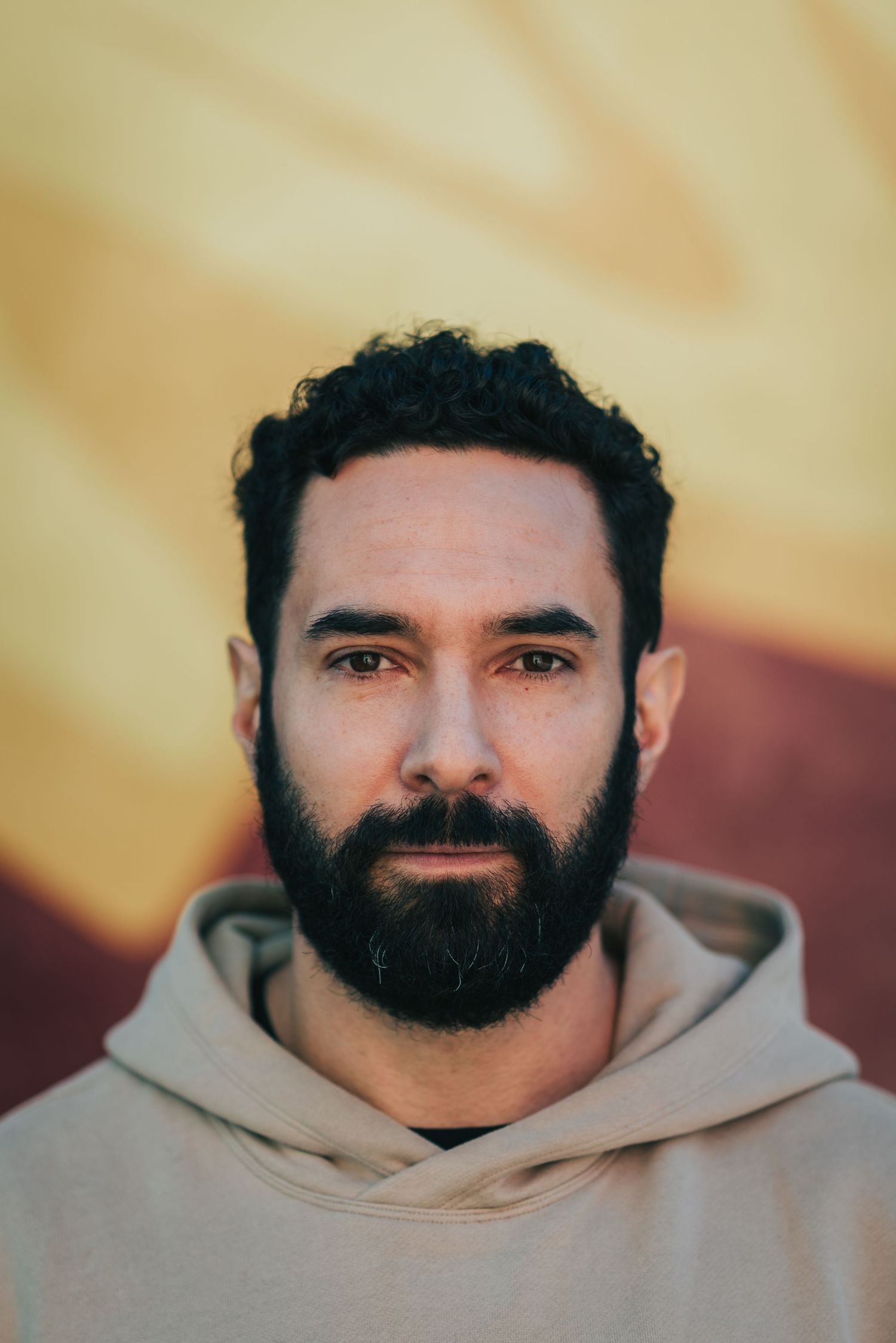 Branding photographer capturing confident portrait for personal brand.