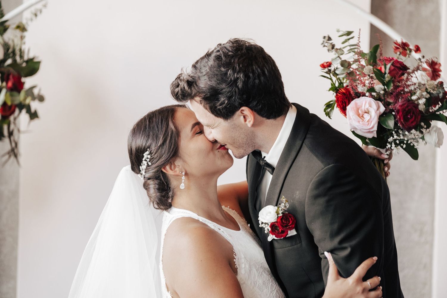 Wedding photographer capturing first kiss at luxury venue in Toronto, Ontario.