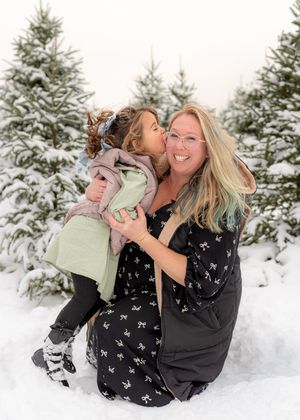 Joyful winter portraits showing playful interactions in a snow-covered forest setting.