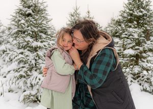 Intimate winter moments captured in sequence against a backdrop of snow-covered pine trees.