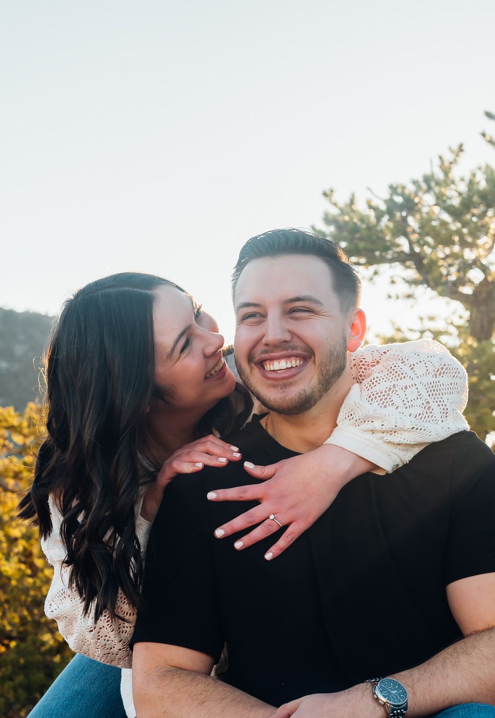 Couple sharing joyful moment outdoors with sunset lighting in canon city Colorado. True to color and timeless couples photo