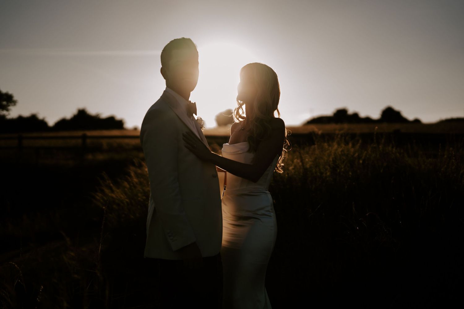 silhouette of bride and groom in sunset at hamswell house wedding in bath