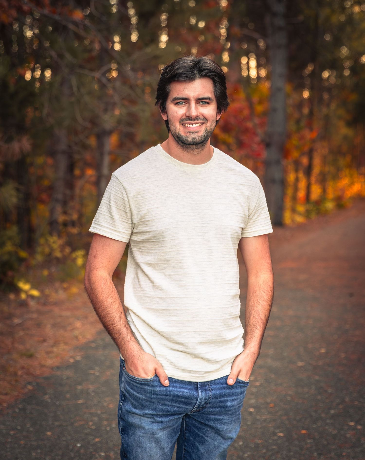 portrait of young man with hands in his pockets