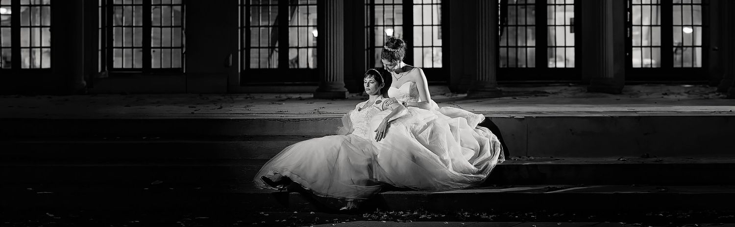 two brides embracing