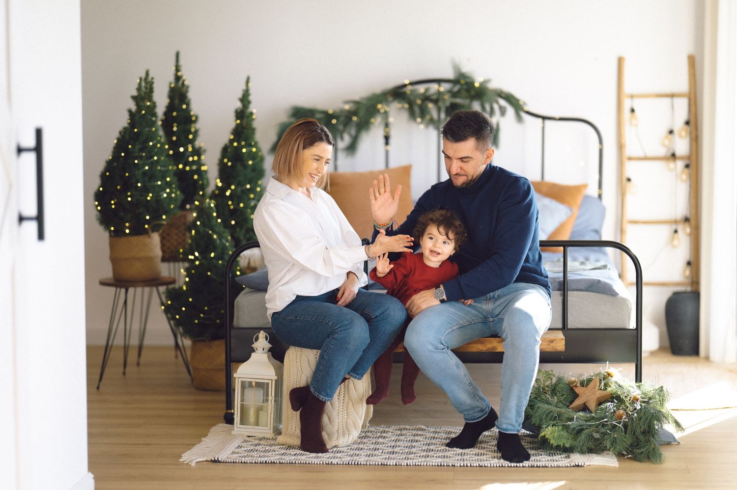 A collection of four interior home photos showing cozy holiday decor with Christmas trees and comfortable living spaces.
