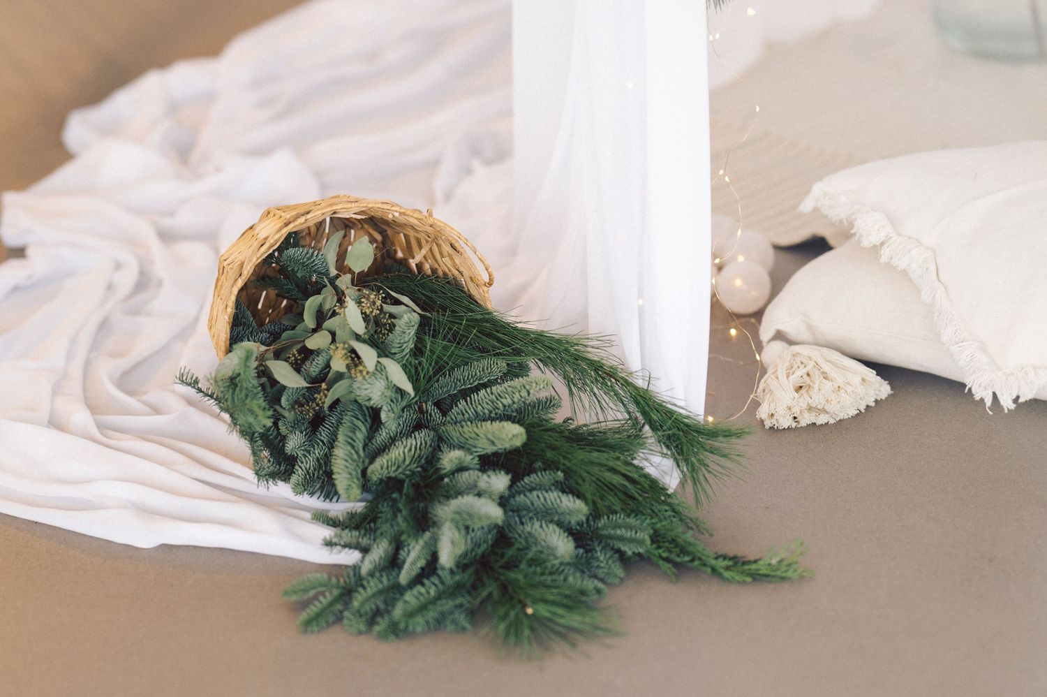Time-lapse sequence showing unboxing of a fresh Christmas tree from a white storage bag in six stages.