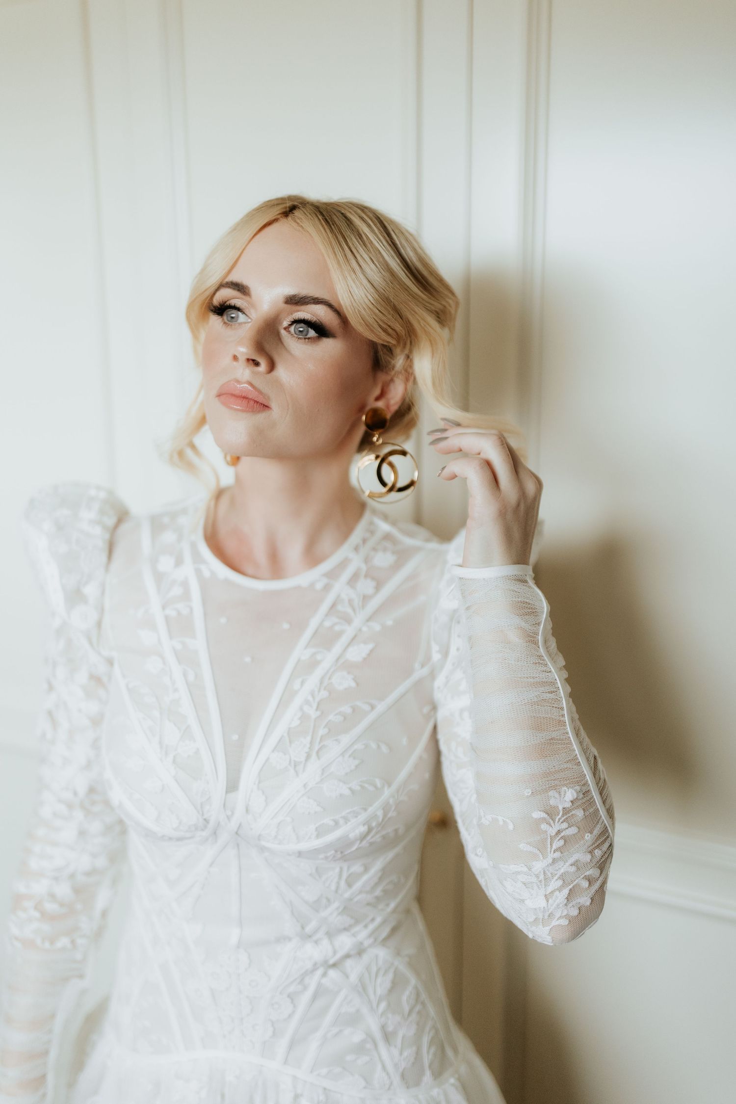 Close-up portrait series showcasing delicate white lace details on a bridal gown.