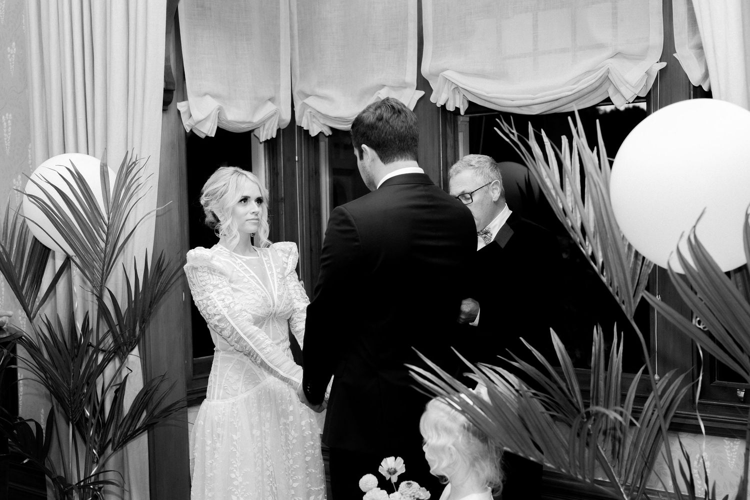Black and white vintage photograph of a couple dancing at what appears to be a social gathering or party.
