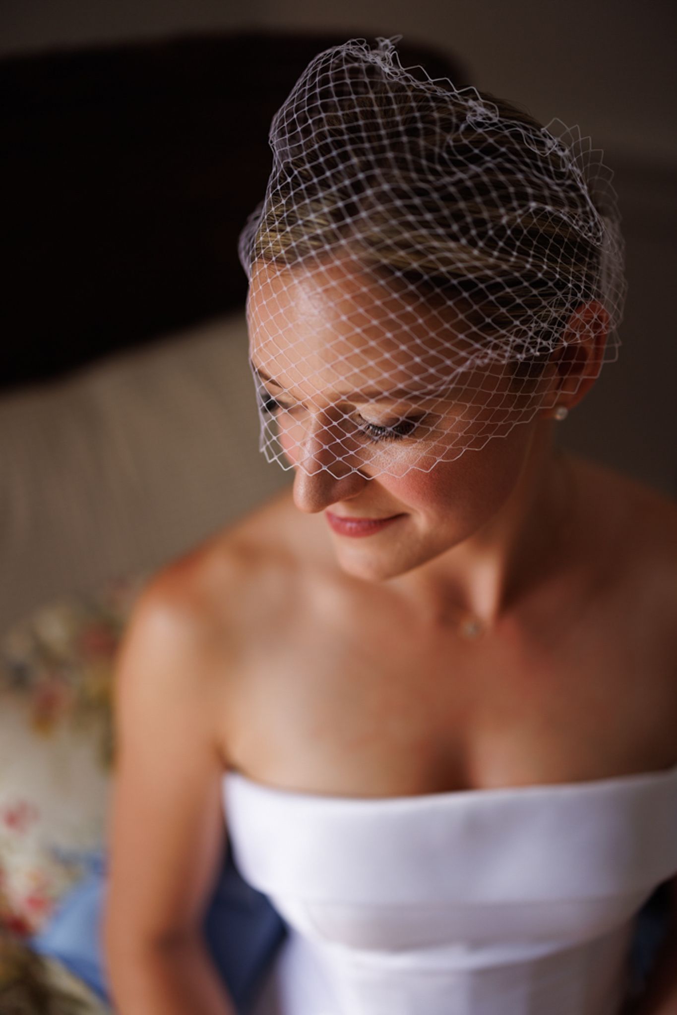 Romantic bridal portrait with classic birdcage veil.