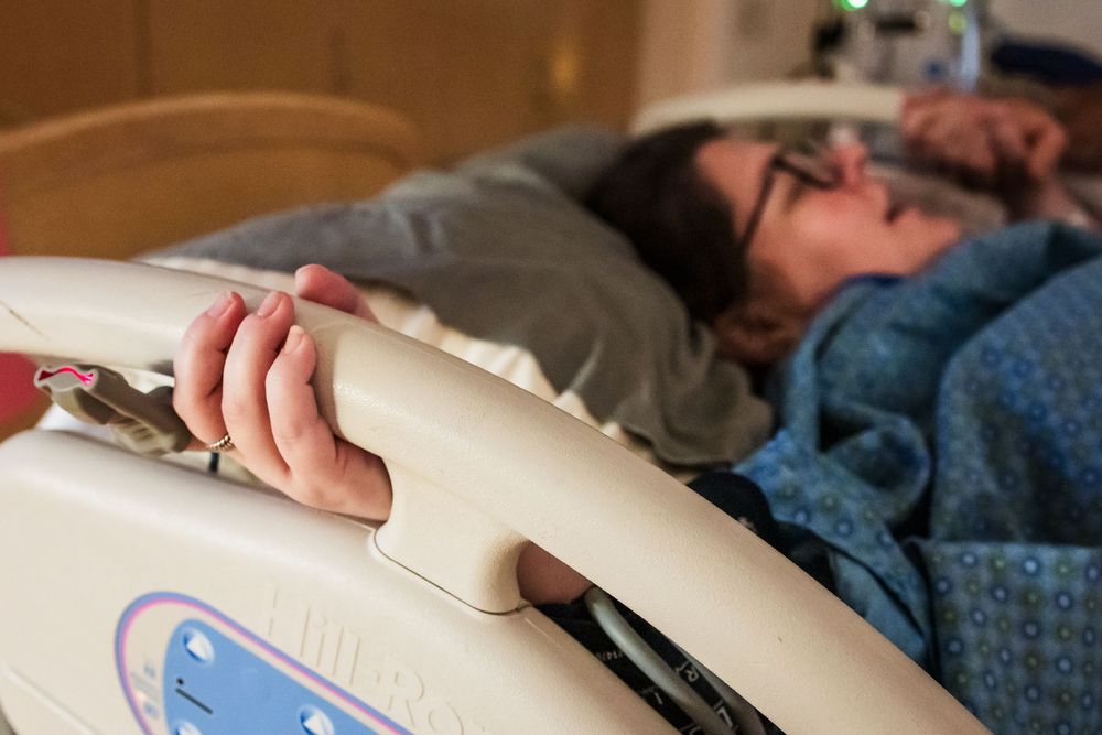 Medical monitoring equipment and pillows in a hospital room setting.