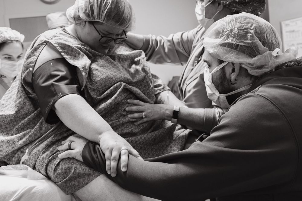 Medical staff working collaboratively during a hospital procedure.