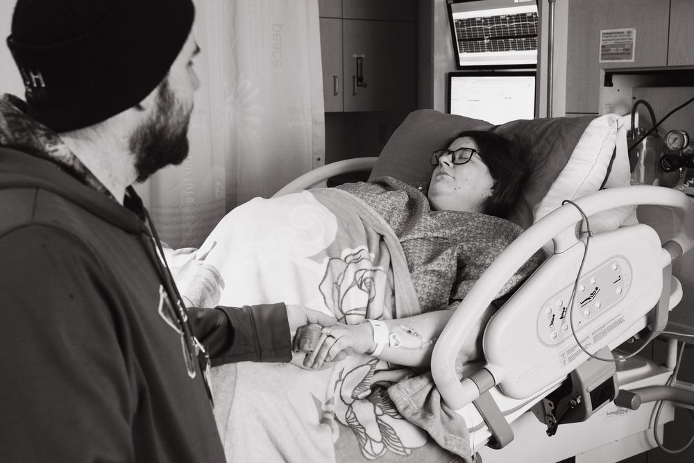 Medical professionals attending to a patient in a hospital setting.