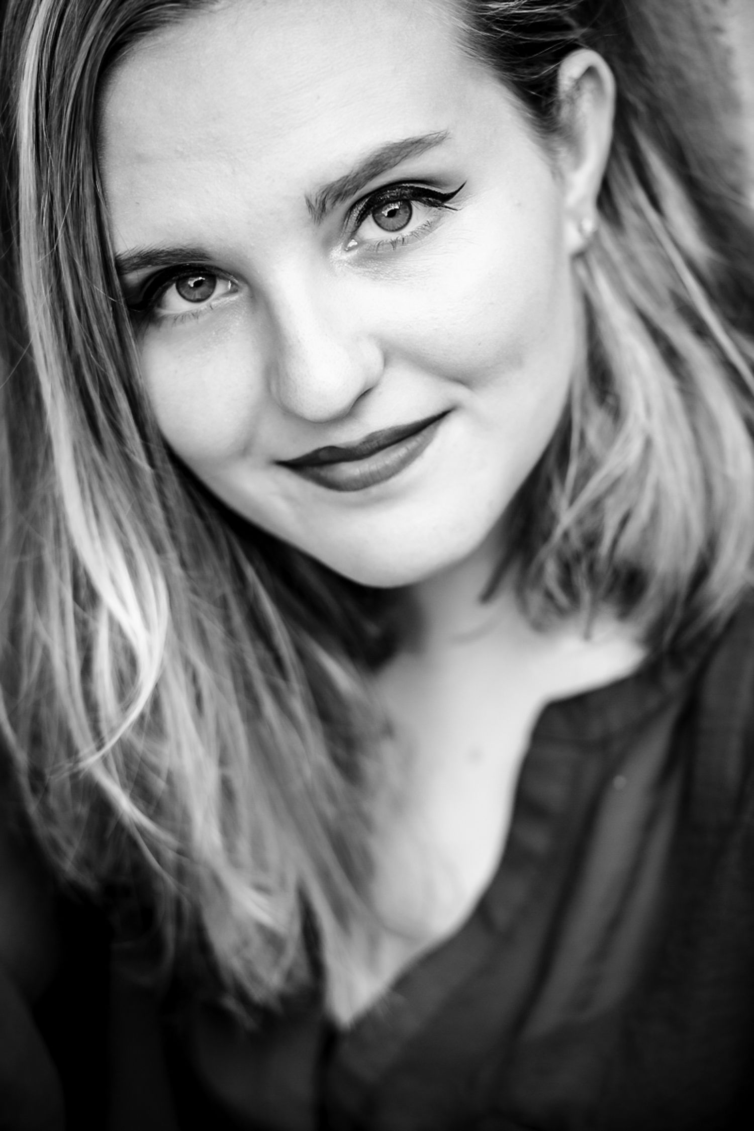 A series of casual selfie portraits showing varied expressions with blonde hair and dramatic lighting.